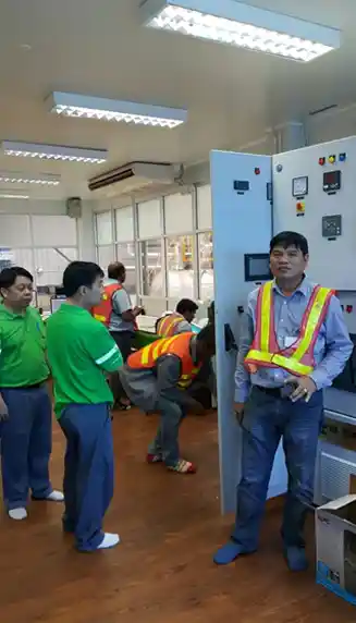 Power plant engineers installing and configuring high efficiency energy conservation steam turbine unit.
