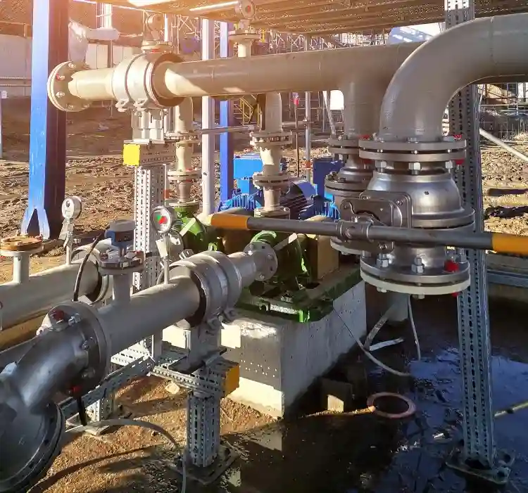 Industrial process pipeline setup with pressure gauges and field instruments for plant automation and monitoring.